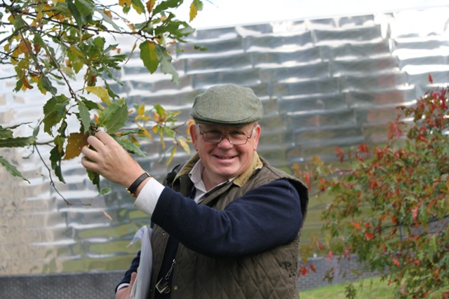 Christopher Howard holding a branch of Cambridge Oak